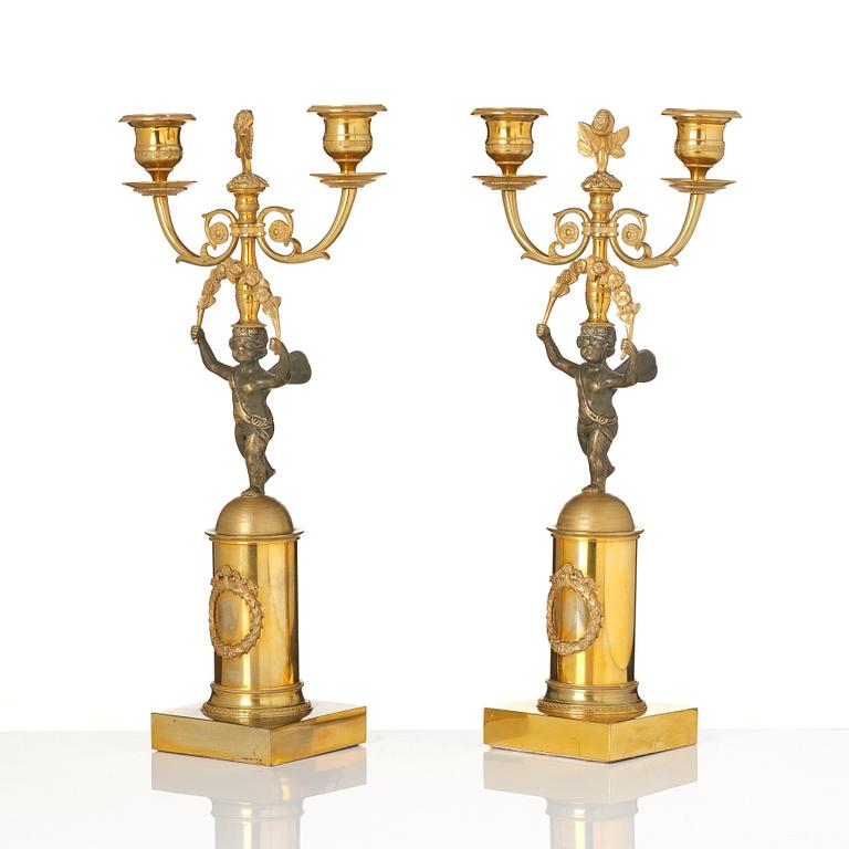A pair of Empire gilt-brass two-branch candelabra, Stockholm, early 19th century.