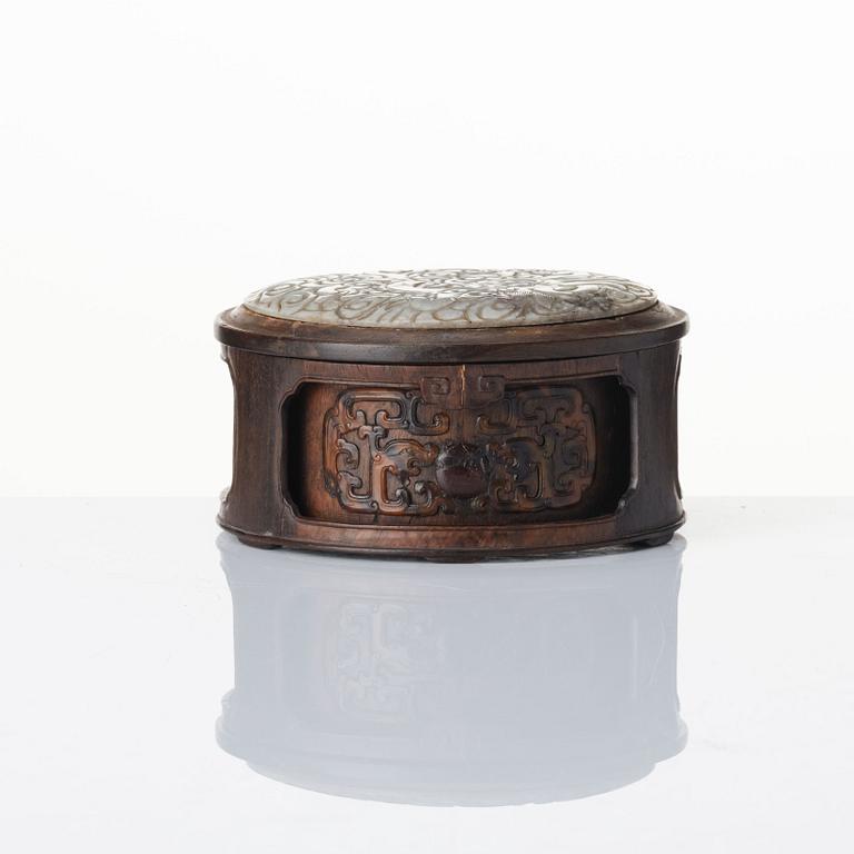 A well carved zitan and jade box, Qing dynasty, 18th century.