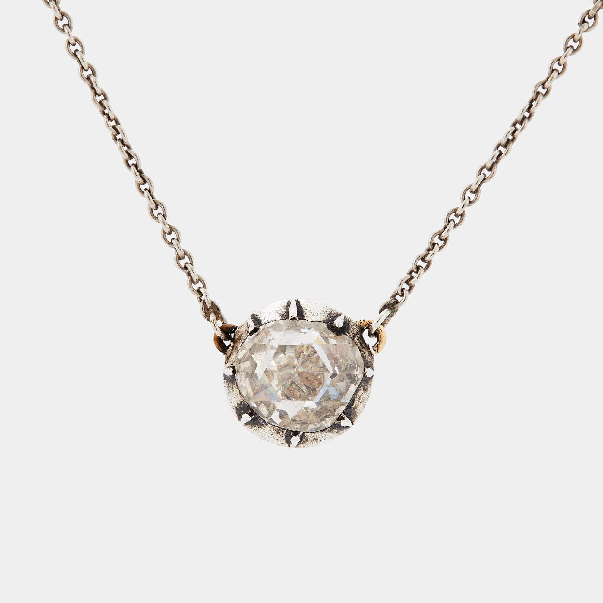 A pendant set with a rose-cut diamond.
