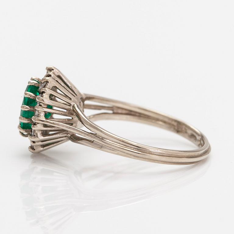 A 14K white gold ring, with an emerald and single-cut diamonds. Finnish import marks.