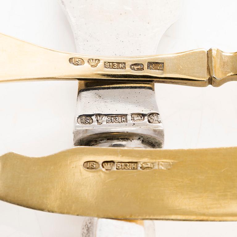 A 12-piece set of parcel-gilt fruit cutlery, and a silver butter knife, maker's mark Iisakki Saha, Pori 1898-1899.