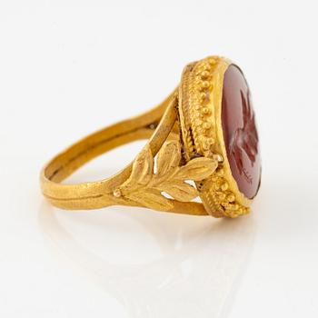 A possibly Etruscan gold and carnelian signet ring.