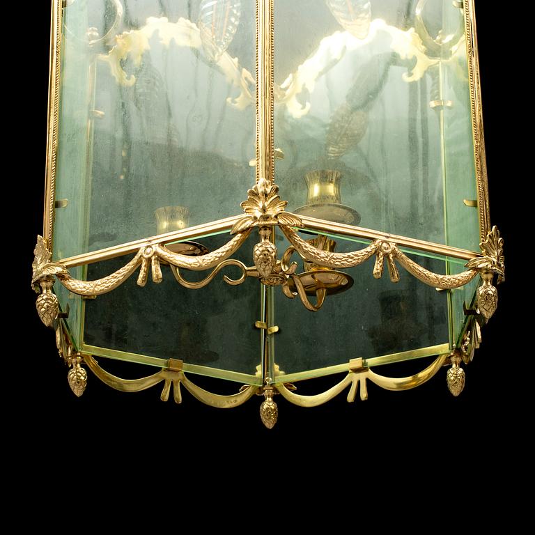 A brass ceiling light "Jubileumslyktan" by K.A. Jonsson, signed and dated 2002.