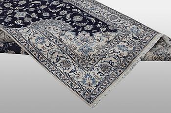 A carpet, Nain, part silk, ca 310 x 205 cm.