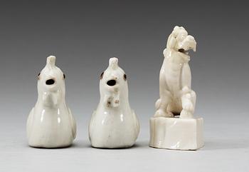 A pair of blanc de chine water droppers and a figure of a 'Buddhist Lion', Qing dynasty, Kangxi (1662-1722).