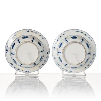 A pair of blue and white Kangxi style dishes, 19th Century.