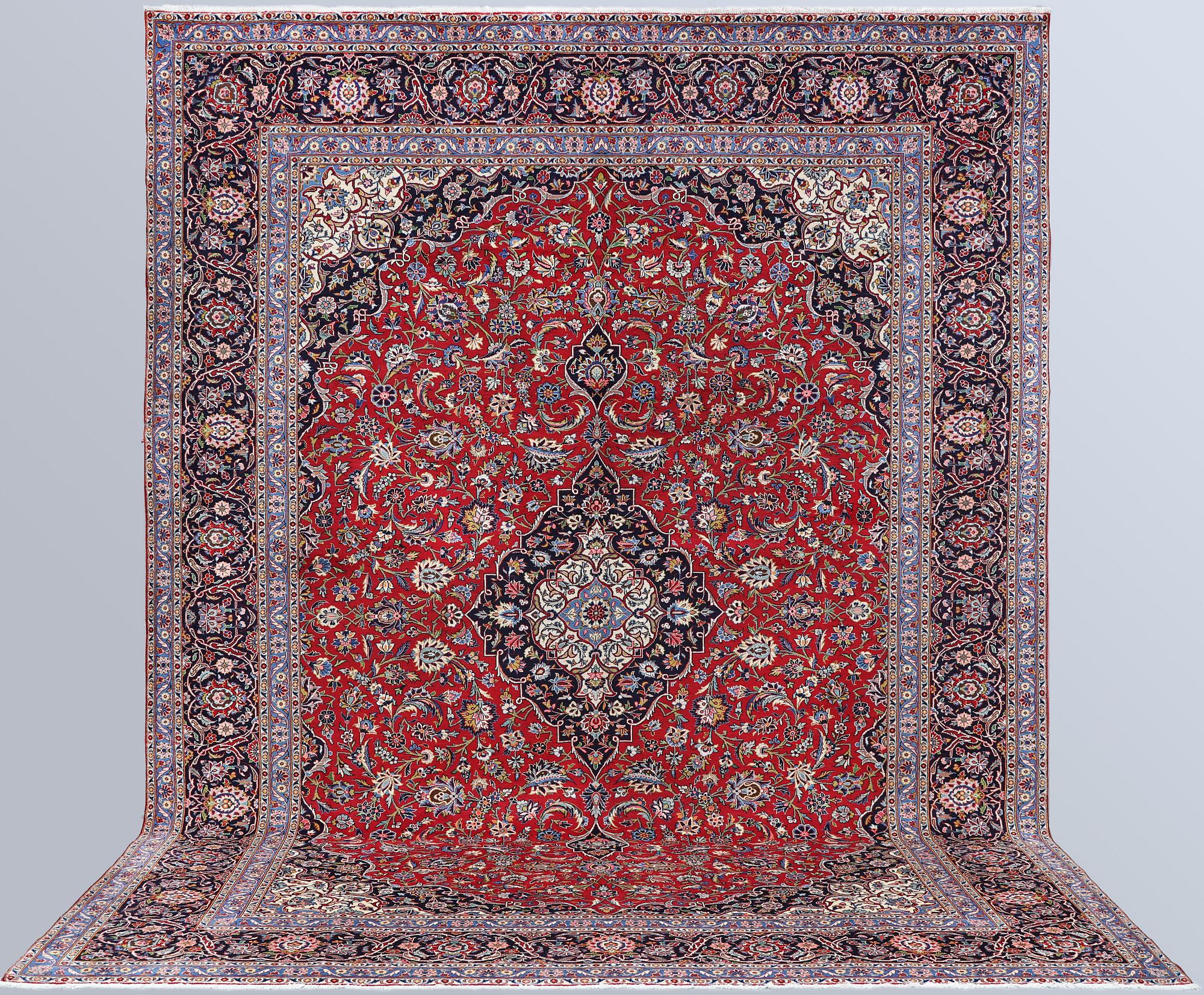 A semi-antique Keshan carpet, approx. 420 x 315 cm.