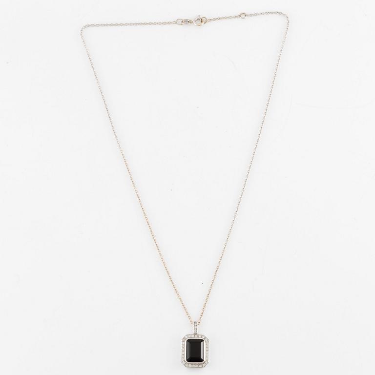 Pendant in 18K white gold set with brilliant-cut diamonds and likely onyx, with chain.