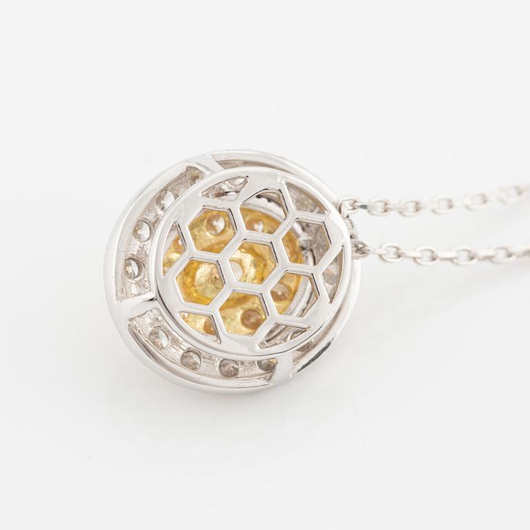Necklace with oval-cut yellow diamond and brilliant-cut diamonds.