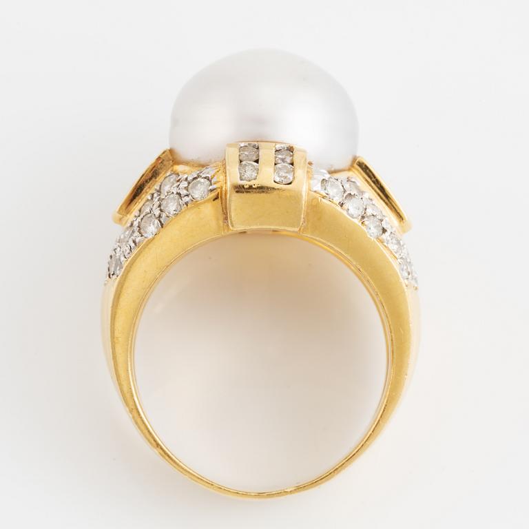 Cultured pearl and brilliant cut diamond ring.