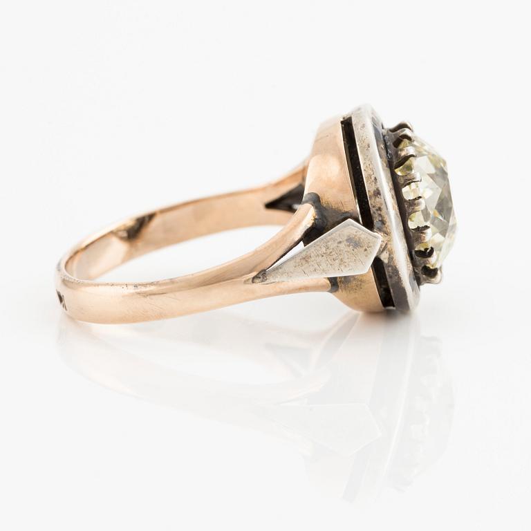 A 14K gold and silver ring with an old-cut diamond.