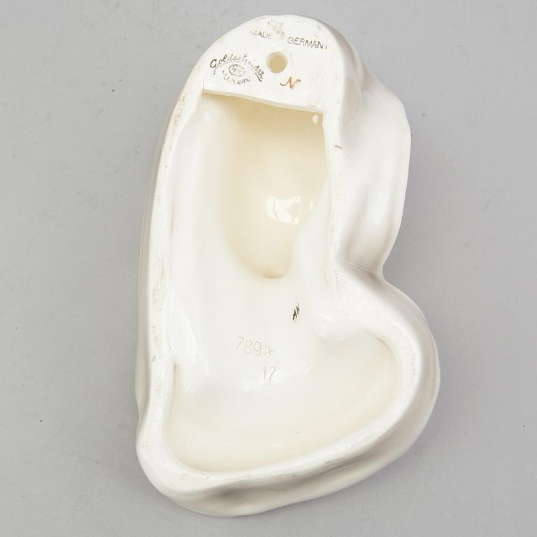 A late 1930s porcelain Goldscheider wall mask, model 7894, marked "Goldscheider Wien" and Made in Germany.
