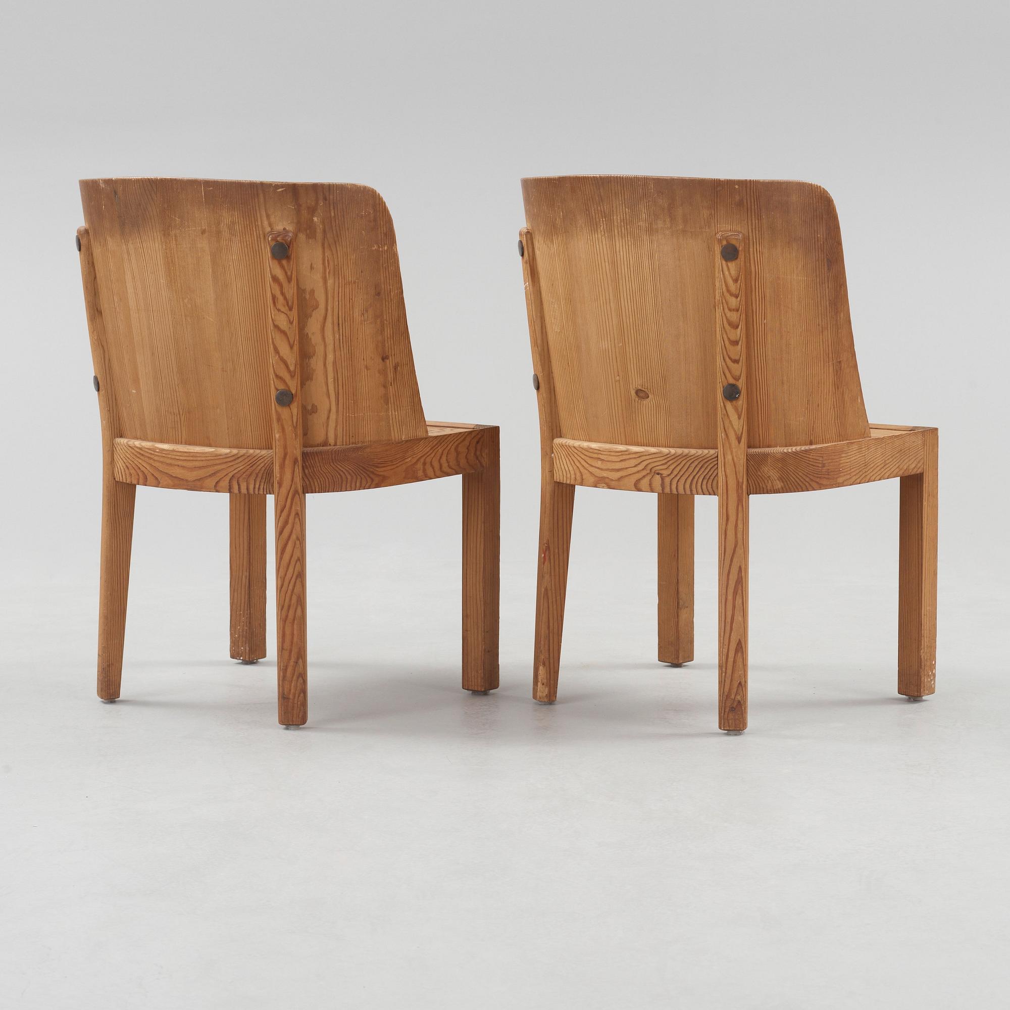 A pair of Axel Einar Hjorth 'Lovö' stained pine armchairs, Nordiska Kompaniet, Sweden 1930's.