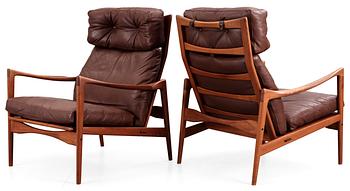 96. A pair of Ib Kofod Larsen teak and brown leather easy chairs, OPE Möbler, Sweden 1960's.