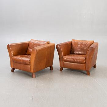 A pair of Lederland leather armchairs Netherlands later part of the 20th century.