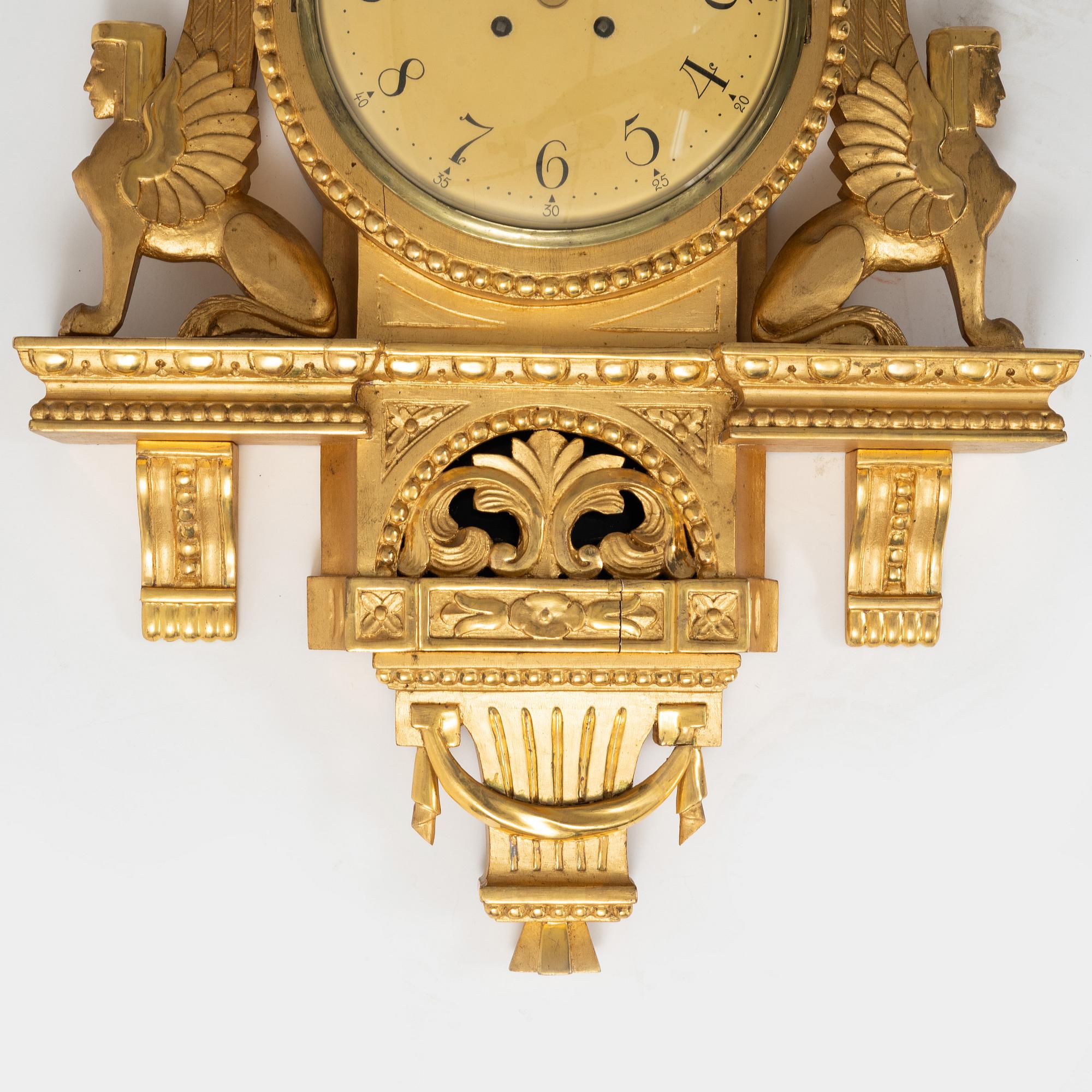 An Empire style wall clock, mid 20th century.