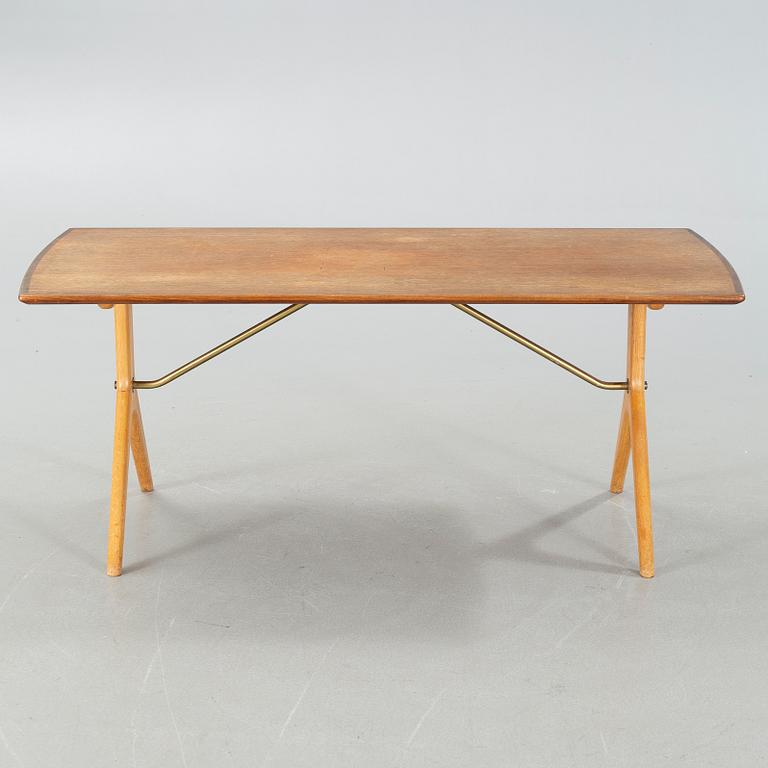 A "Krysset" sofatable, designed by Karl-Erik Ekselius for JO Carlsson, launched 1952.