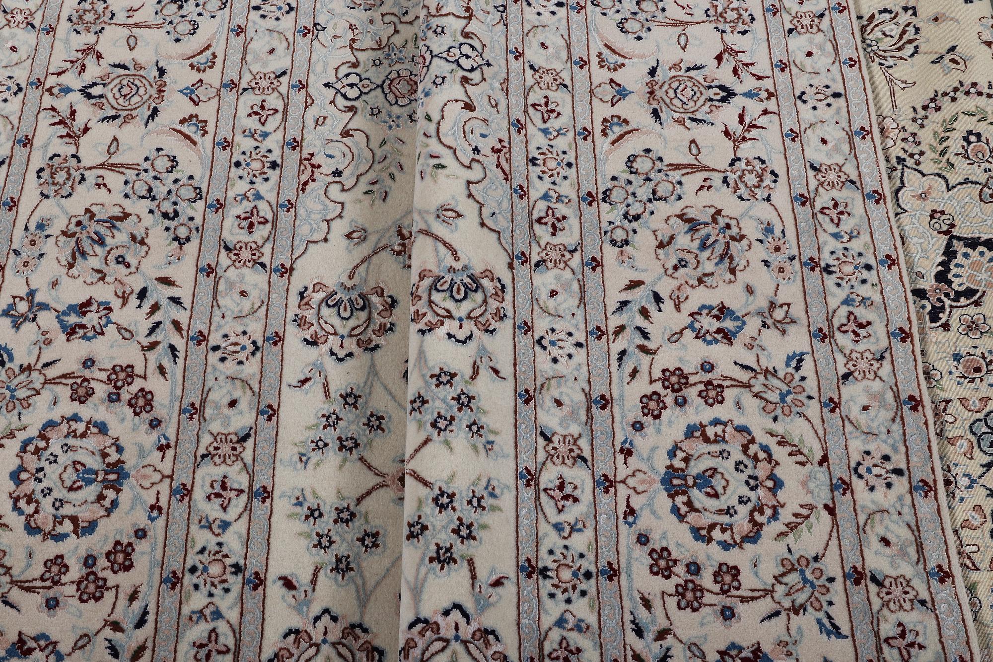A carpet, Nain, part silk, ca 341 x 245 cm.