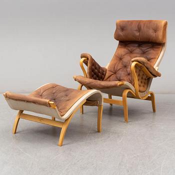 BRUNO MATHSSON, a 'Pernilla' beech easy chair and ottoman from Dux.