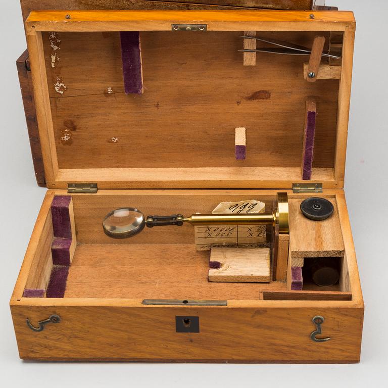 A set of three wodden boxes for microscopes, around 1900.