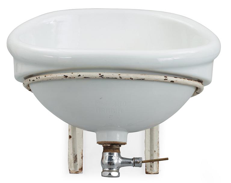 An Alvar Aalto molded porcelain wash basin for the Paimio Sanatorium, Arabia, Finland 1930's.