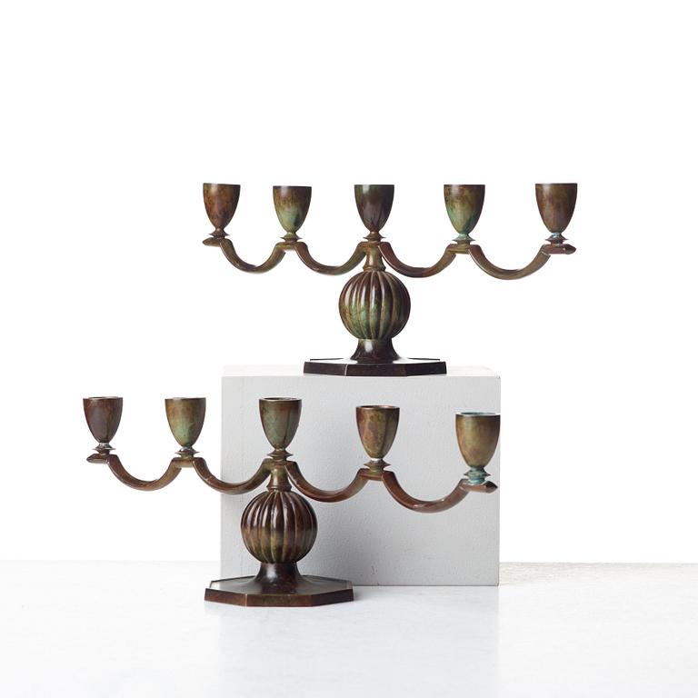 GULDSMEDSAKTIEBOLAGET (GAB), a pair of Swedish Grace patinated bronze candelabra, Stockholm 1930's.