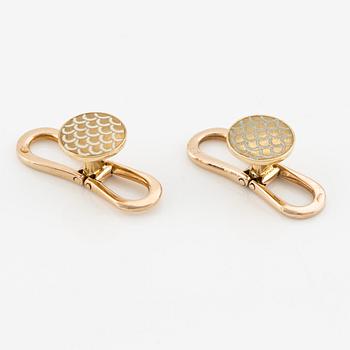 W.A. Bolin a pair of shirt studs 18K gold with white enamel.