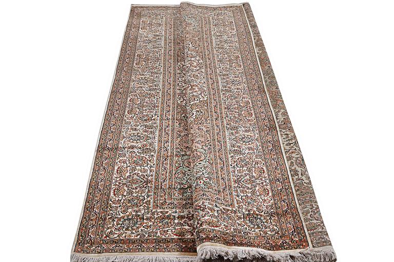 A carpet, silk Kashmir, ca 303 x 216 cm.