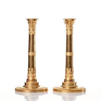 A set of four Empire presumably Russian candlesticks in gilded bronze.