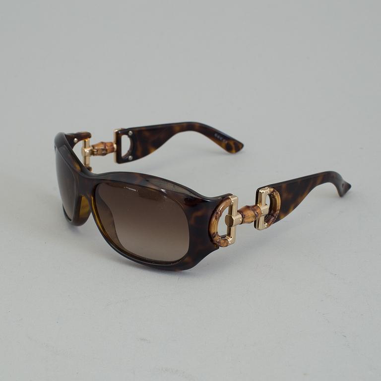 A pair of Gucci GG2970/S sunglasses with case.