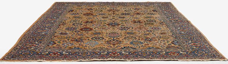 A semi-antique Tabriz carpet of vase design, West Persia, c. 404 x 292 cm.