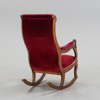 A 19th century swan arm rocking chair.