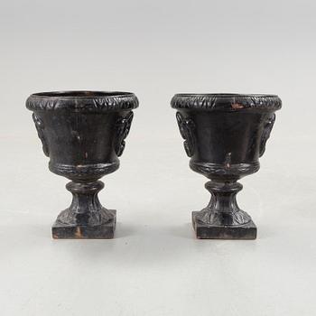 A pair of cast iron garden urns, Norrtälje.