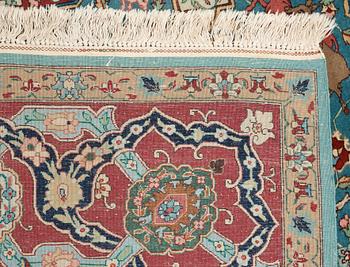 A CARPET. An old Tabriz. 339 x 244,6 cm.