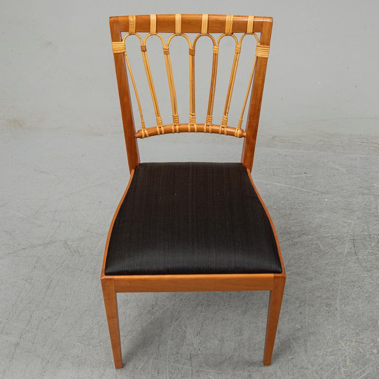 A set of four mahogany and rattan dining chairs, Josef Frank, , model 1165, Svenskt Tenn, Stockholm.