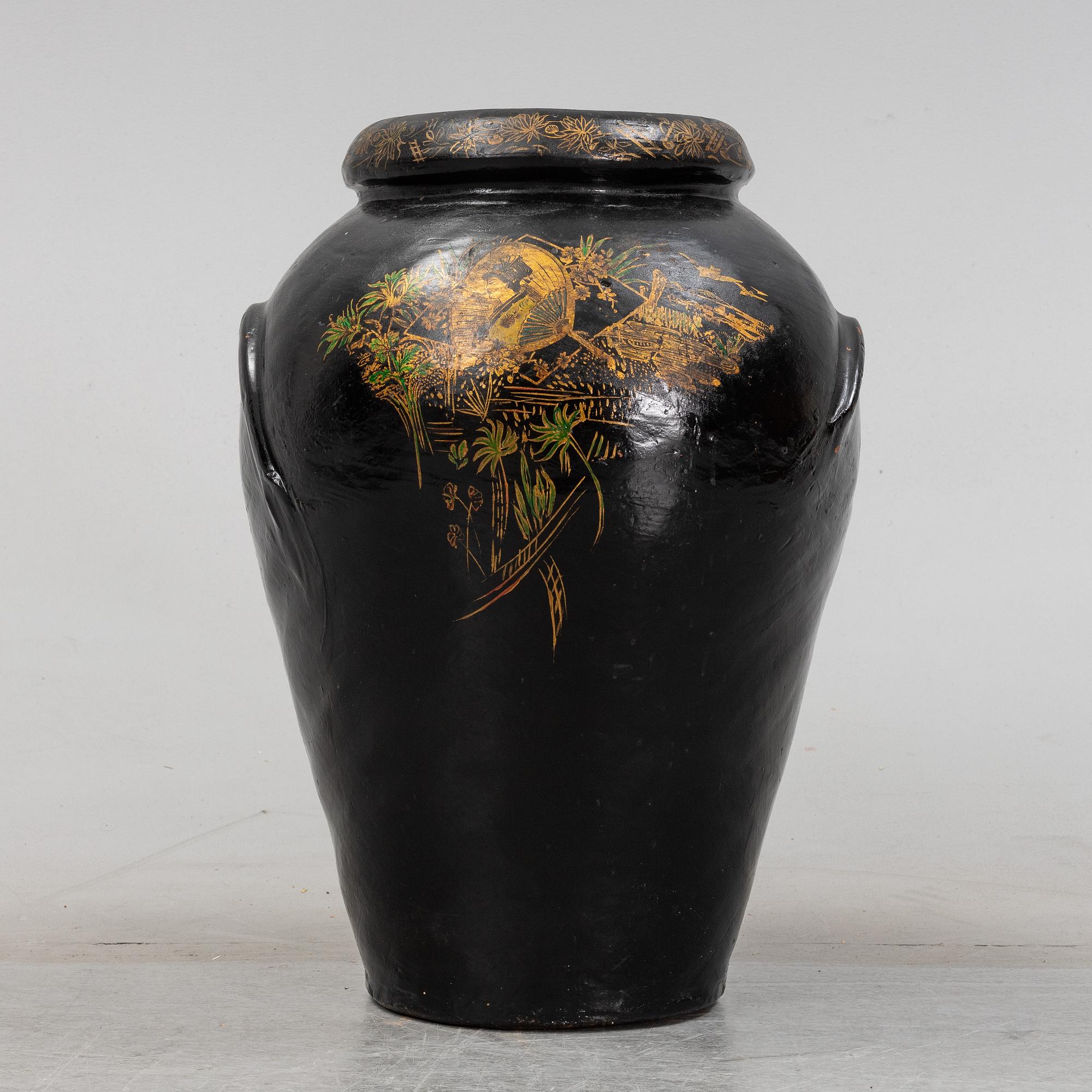 A 20th Century earhten ware urn.