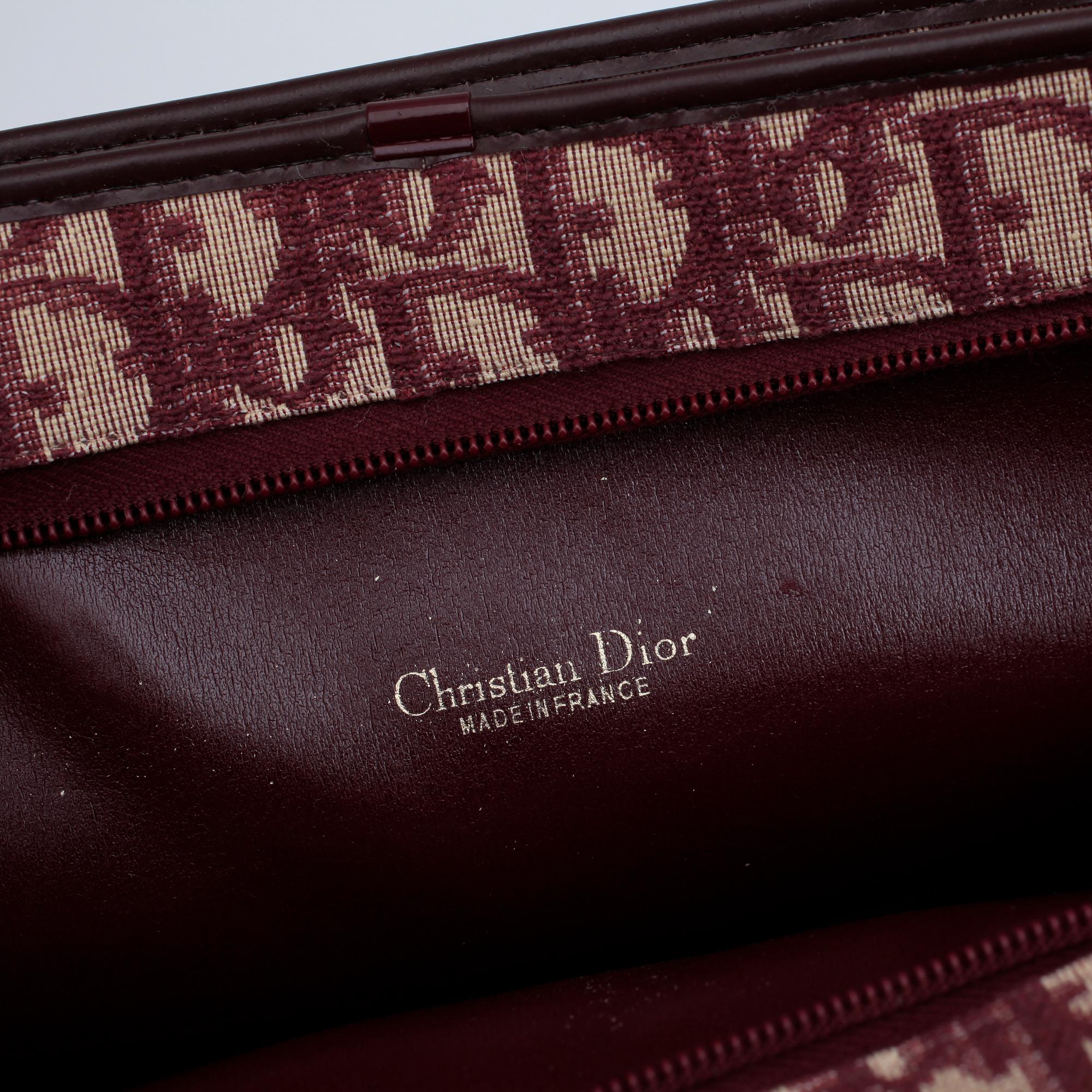 CHRISTIAN DIOR, a red monogram canvas handbag.