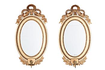 A pair of late Gustavian late 18th century one-light girandole mirrors.