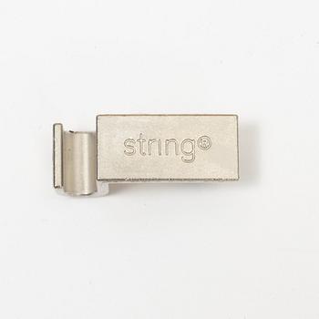 A 'String' shelving system by Nils Strinning, with three sides and 12 shelves.