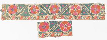 Two antique Suzani embroidery fragments, c 162 x 27.5 and 54 x 25 cm.