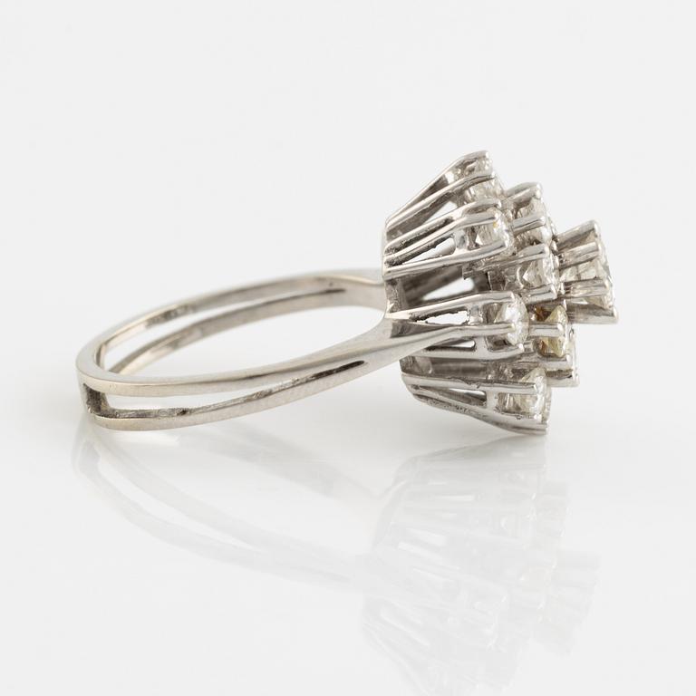 14K white gold and brilliant cut diamond cluster ring.