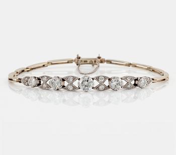 1078. An 18K gold and platinum bracelet set with old- and eight-cut diamonds.