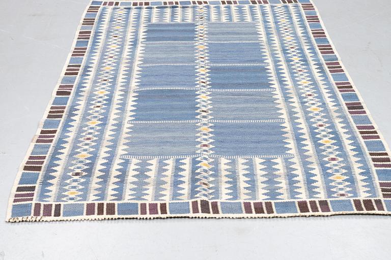 Barbro Nilsson, a carpet, "Salerno blå", flat weave, ca 245 x 177 cm, signed AB MMF BN.