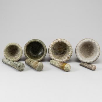 Four Swedish green marble mortars and pestles, early 20th century.