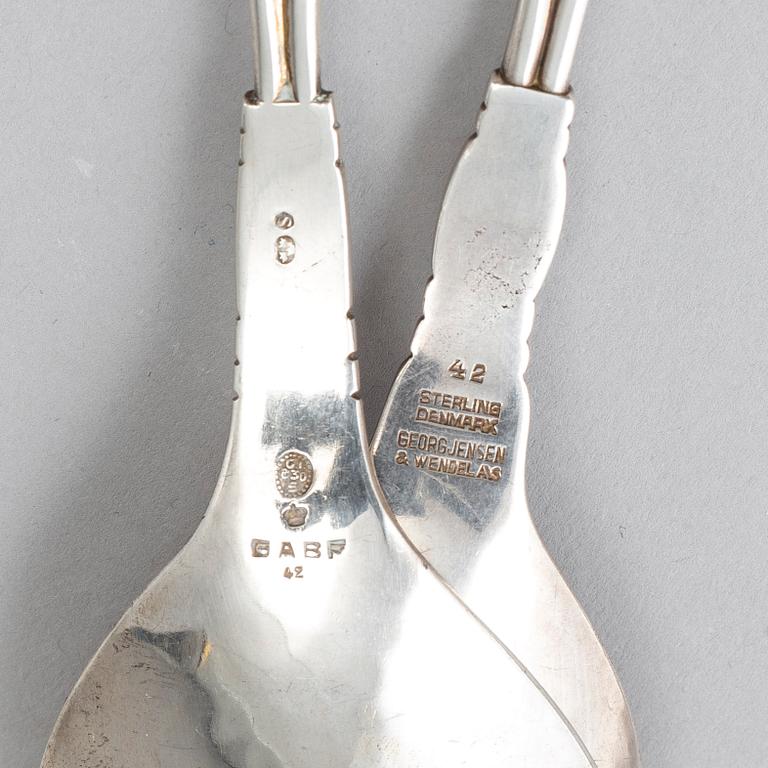 GEORG JENSEN, a pair of silver spoons, mid 20th century.