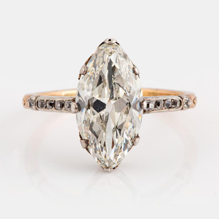 A 14K gold and silver ring set with a navette-cut diamond with a total weight of ca 2.75 cts quality ca K vs.