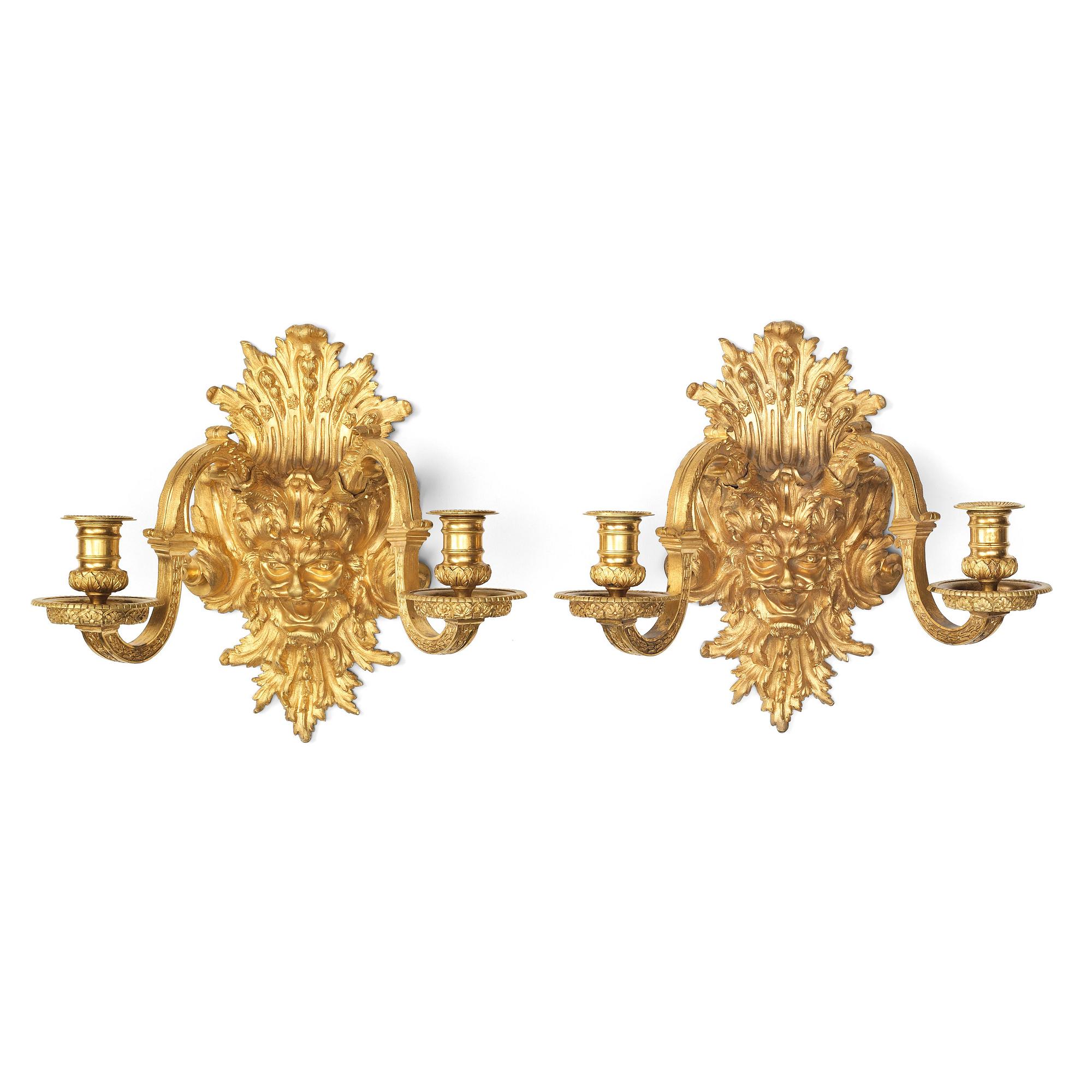 A pair of Baroque-style mid 19th century two-light wall-lights.