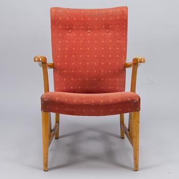 A mid 20th century open armchair.