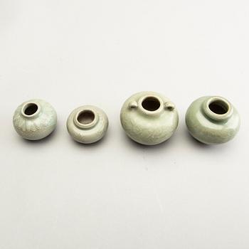 A group of four celadon glazed miniture pots, South East Asia, 16th/17th Century.