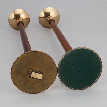 HANS-AGNE JAKOBSSON, a pair of brass and teak candle holders, Markaryd, mid 20th century.